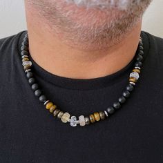 "Men's Necklace with citrine, Beaded boho necklace for men Beautiful and unique necklace I created by using black stones with Citrine, Tiger's eye, and Pyrite. This impressive and powerful necklace is charged with the energies of gems The color combination and shapes of the stones give a natural, earthy feel. Beautiful necklace for everyday use. Perfect to keep or to give as a gift. This Necklace comes gift-wrapped, ready to be gifted. Materials: *Black Stone *Citrine *Pyrite *Tiger eye *Stainle Crystal Necklace For Men, Men Beaded Necklace Ideas, Black Gemstone Beaded Necklace With Spiritual Style, Spiritual Black Beaded Gemstone Necklaces, Spiritual Black Beaded Gemstone Necklace, Spiritual Black Gemstone Beaded Necklace, Black Necklaces With Gemstone Beads For Healing, Black Gemstone Beads Necklace For Healing, Black Necklace With Gemstone Beads For Healing