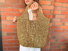 Crochet Raffia Tote Bag | Straw Beach Bag | Oversize Shoulder Bag | Boho Woven Bag | Knitting Shopping Bag | Xlarge  Bag Crochet Gold Metallic Raffia Tote Bag | Mesh Beach Woven Shoulder Bag | XLARGE Bag This handmade crocheted beach bag is completely hand-knitted using gold metallic raffia It's huge and enough for your daily needs. It is completely useful at every opportunity, from shopping to parties, from sports events to fancy parties. And of course a good accessory can do a miracle with you Gold Bucket Bag For The Beach, Gold Bucket Bag For Beach, Gold Summer Travel Bucket Bag, Gold Handwoven Straw Bag For Vacation, Gold Handwoven Straw Travel Bag, Handwoven Gold Straw Bag For Vacation, Gold Summer Beach Bag, Gold Summer Beach Bags, Summer Gold Beach Shoulder Bag