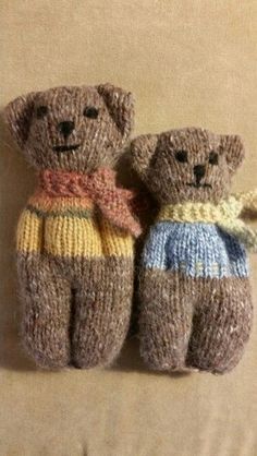 two knitted teddy bears sitting next to each other