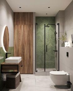 a bathroom with a toilet, sink, and shower stall in it's corner