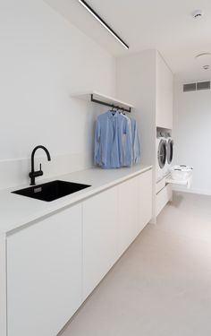 a laundry room with washer and dryer in it