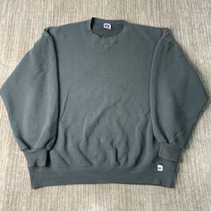 Vintage 90s Russell Athletic Basic Blank Sportswear Made in USA Streetwear Green Pullover Crewneck Extra Large Mens Condition:  Excellent Used Condition  = No Flaws Measurements: Please see photos above for all measurements IF YOU BUY TWO OR MORE ITEMS USE THE CODE BUNDLE @ CHECK TO SAVE 20% WE SHIP WITHIN 24 HOURS AFTER PURCHASE! Please be aware that we do not offer free returns!! The Buyer is responsible for the cost of the return label.  Follow us on TikTok & Instagram @findsnostalgic and tag Casual Solid Color Sweater For Sports, Casual Solid Sweater For Sports, 90s Style Winter Sports Sweatshirt, 90s Style Relaxed Fit Sweatshirt For Sports, 90s Style Relaxed Fit Sports Sweatshirt, 90s Oversized Sweatshirt For Sports, 90s Style Long Sleeve Sports Sweatshirt, Vintage Green Crew Neck Top, 90s Style Green Cotton Sweatshirt