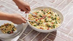 a person is cutting up some food in a bowl