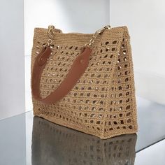 a handbag sitting on top of a glass table