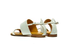 Sophisticated summer attitude in white elegant strappy sandals. There is no more to say, just wear your new pair of sandals and enjoy the summer. This pair of sandals are ultimate in everyday casual, perfect balance between beach-ready and urban appropriate. Hand crafted from the softest leather and cushioned for extra comfort and with wide straps they make the most comfortable fit. This sandals are perfect choice for every day or night of the summer. Style yours with everything from dresses to White Open Toe T-strap Sandals For Summer, White Leather T-strap Sandals For Summer, Elegant T-strap Sandals With Flat Heel For Vacation, White T-strap Open Heel Sandals For Spring, White T-strap Sandals With Open Heel For Spring, Summer Sandals With Ankle Strap In White, Chic T-strap Sandals For Summer Vacation, Elegant T-strap Sandals With Ankle Strap For Summer, White Open Heel Slingback Sandals For Vacation