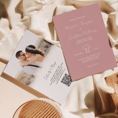 an image of a wedding card on top of a table with other items around it