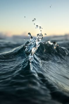 water splashing on top of the ocean waves