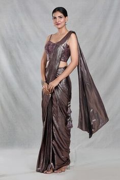 Copper brown shimmery pre-draped saree with iridescent stripes and tassel embellishments detailing. Paired with a strap sleeves sweetheart neck blouse with bloom embroidery using tonal cutdana, beads, sequin highlights. - Aza Fashions Sweetheart Neck Blouse, Bloom Embroidery, Ruffle Sarees, Draped Saree, Ruffle Saree, Drape Saree, Copper Brown, Saree With Blouse, Sweetheart Neck