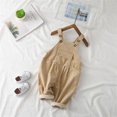 Girls Corduroy Solid Casual Jumpsuits - PrettyKid Casual Cotton Bodysuit For Winter, Beige Cotton Jumpsuits And Rompers For Fall, Brown Cotton Winter Jumpsuits And Rompers, Beige Cotton Overalls, Casual Brown Cotton Bodysuit, Winter Corduroy Overalls, Casual Beige Cotton Bodysuit, Cotton Winter Overalls, Winter Cotton Overalls