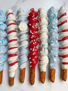 there are many different types of ice cream cones in the shape of snowmen on sticks