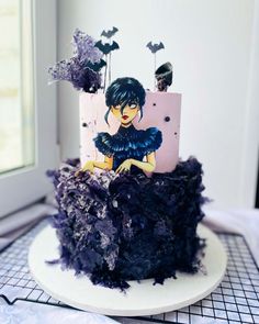 there is a cake decorated with an image of a woman on it