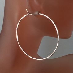 Simple solid sterling silver or argentium sterling hammered hoops available in a variety of sizes and wire thickness (metal gauges 18, 19 and 20. 18 gauge is 1mm wire, 19 gauge is slightly thicker and 20g wire is .8mm. 20g wire fits all standard ear piercings. Choose size from 1/2 inch to 3 inches. All earrings will be polished and have rounded earring ends for comfort. Backings will be included to prevent earring loss. All hoops are hand constructed by Cecile Stewart. -pair -hypoallergenic nick Sterling Silver Hoop Earrings With Ear Wire, Hammered Rose Gold Sterling Silver Hoop Earrings, Adjustable Sterling Silver Hoop Earrings With Ear Wire, Rose Gold Hammered Sterling Silver Hoop Earrings, Sterling Silver Circle Hoop Earrings With Ear Wire, Hypoallergenic Silver Hoop Earrings In Brass, Silver Hallmarked Metal Hoop Earrings, Interchangeable Earrings, Contemporary Earrings