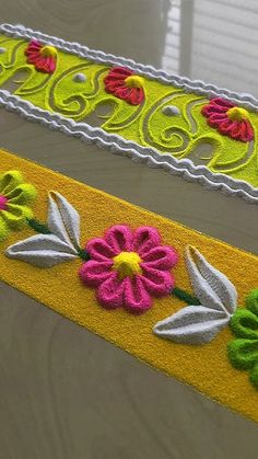 two decorative rugs with flowers on them