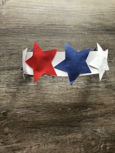 three red, white and blue stars are on top of each other in different directions