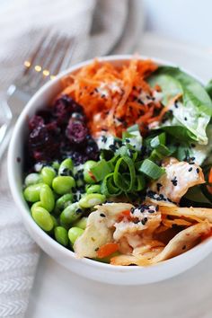 a white bowl filled with different types of food