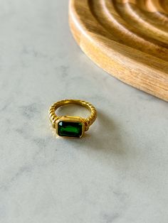 Shine bright like an emerald with our Emerald Ring. Made of 18k gold plated material, this ring adds a touch of elegance to any outfit. Sparkle and stand out with this beautiful and unique accessory. (No need to be a gemologist to know this ring is a true gem!) 18k gold plated braided detail Suede Hat, Emerald Ring, Accessories Unique, Shine Bright, Wool Felt, 18k Gold, Emerald, Gold Plate, Ring Size