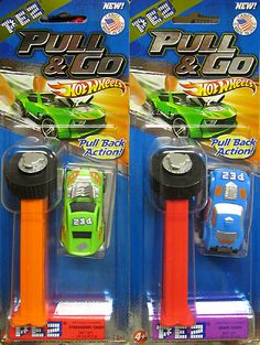 two green and orange hot wheels cars on display