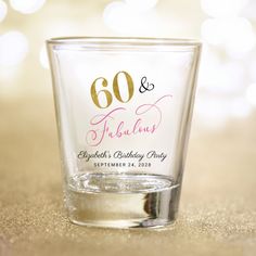 a shot glass with the number 60 and fabulous birthday party written on it