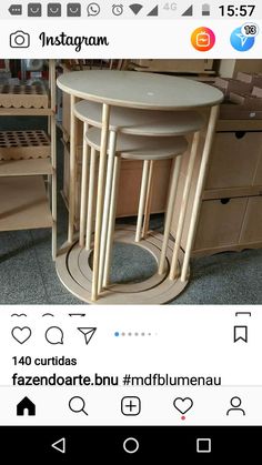 three wooden tables sitting next to each other on top of a carpeted room floor