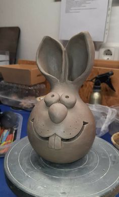 a clay bunny sitting on top of a table