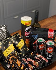 an assortment of snacks and drinks on a tray