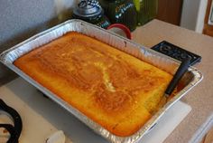 a cake in a pan sitting on top of a counter next to a stovetop