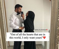 a man and woman standing next to each other in front of a mirror with the caption out of all the hearts that are in this world, i only want yours