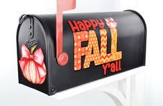 a black mailbox with the words happy fall y'all painted on it