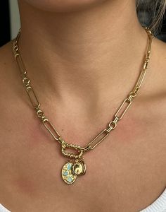 "Chunky Gold Chain Necklace Connected by a Twisted Carabiner with 3 Charms: a Blue Speckled Oval, a Mini Locket, and a Small Hammered Imperfect Oval. This beautifully ornate piece is bound to attract all sorts of attention and compliments! This necklace is feminine, bold, and unique all at the same time. It can be layered with other chains for a stacked look, or worn alone as a simply elegant statement piece. The charms can also be taken off, and put back on with ease.  💭Materials: Lead & nickel free always Chain is 24k Gold filled (and quite resistant to tarnishing)  Charms are 24k Gold plated 💭Length: 18\" in the listings photos & videos  **If you would like the necklace to be longer or shorter than 18\", please specify in the personalization section the length you would like instead. Gold Link Locket Jewelry, Chunky Gold Chain Necklace, Carabiner Necklace, Chunky Gold Chain, Stacked Necklaces, Gold Locket, Jewelry Inspo, Dream Jewelry, Gold Chain Necklace