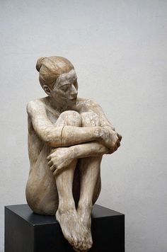 a sculpture of a man holding a woman