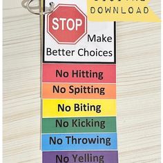 there is a stop sign on top of this keychain that says stop make better choices no hitting no splitting no kicking no throwing no throwing no