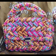 This Stylish Bag Totes A Bohemian Feel In Vivid Orange, Pink And Ice Blue Soft Crochet Material. Striking Gold Hardware Accentuates The Visual Appeal. Hold By The Attached Handle Or Use The Included Shoulder Strap To Convert It Into A Purse. The Interior Provides Ample Room For Keys, Credit Cards, Makeup Items, Or Many Phone Models. Interior Size: 7 X 4 In. Soft Crochet, Crochet Weaves, Pink Crochet, Blue Soft, Makeup Items, Stylish Bag, Orange Gold, Handbag Purse, Orange Pink