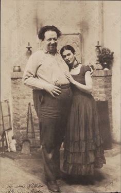 an old black and white photo of two people