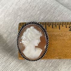 Vintage 1940s carved shell cameo set in a sterling filigree base. Safety clasp. Could also be worn as a pendant. Stamped BS 800. SIZE 1 1/8" x 1 3/8" CONDITION Gently worn, may need polishing. This is a vintage item. It has been used and loved and it has a history. Please examine photos carefully and ask questions, as we are unable to accept returns or exchanges. Carved Shell, Shells, Vintage Items, Carving, Pendant