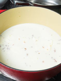 a pan filled with food sitting on top of a stove