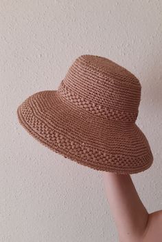 Women's hat crocheted from viscose raffia in beige color. Raffia is a natural, environmentally friendly, biodegradable and hygroscopic material. The hat is stylish, comfortable, transpirable, light and very durable, it will last more than one year. Perfect for the summer. The last row is specially reinforced and keeps its shape perfectly. Dimensions: Head circumference 57-58 cm Hat brim 10 cm Care: Do not wash. Wipe it with a clean damp cloth. In case it is wrinkled or out of shape, you can steam it with an iron at medium temperature. Can be sent to you immediately after ordering. If you have any questions regarding this hat, feel free to ask. You can also find me on Instagram @liana.knitting.craft Gardening Hat, Raffia Hat, Beige Color, Sun Hats, Floppy Hat, Hats For Women, Biodegradable Products, Caps Hats, Pattern Design