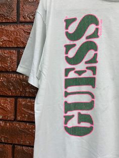 "Vintage 80s Guess New York Surfing Style Spell Out Logo T Shirt / Hip Hop 90s / 90s Streetwear T Shirt Made In Usa Size M Condition : Good Used Size on tag : M Colour : Greenish Brand : guess Measurement : Armpit to armpit -21\" Length - 24\" Material : Old Cotton Made In: USA THE SHIPPING (Your Choice Please read) 1. The shipping cost is USD 20 via Malaysian Registered Postage With Tracking Number. It will take 2-4 weeks or more for delivery, depends on your custom checking. 2. Add USD 10 for 90s Green Letter Print Tops, 90s Green Tops With Letter Print, Green Retro Graphic Design Top, 90s Style Green T-shirt For Spring, 90s Style Green Screen Print Top, 90s Green T-shirt With Logo Print, Retro Green Tops With Logo Print, 90s Style Green T-shirt With Logo Print, Retro Green Top With Logo Print