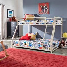 a bunk bed sitting in a bedroom next to a red rug on top of a wooden floor