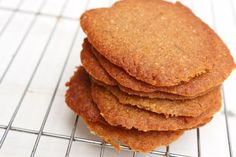 a stack of cookies sitting on top of a cooling rack