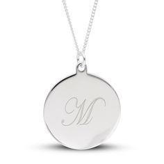 Bring Personalized panache to any look with this simple yet chic engravable disc pendant in silver. Fashioned in sterling silver This small round disc showcases your single initial - inscribed in an artful cursive font at the center. The pendant suspends along an 18.0-inch curb chain that secures with a spring-ring clasp. Classic Polished Initial Pendant Jewelry, Formal Round Necklace With Initials, Classic Personalized Medallion Jewelry, Classic Round Pendant Jewelry With Initials, Silver Monogram Pendant Necklace, Elegant Silver Initial Necklace With Monogram, Classic White Gold Monogram Initial Necklace, Elegant Silver Monogram Initial Necklace, Formal Monogram Sterling Silver Jewelry