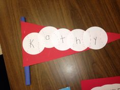 a craft made to look like a caterpillar with the word kathy on it