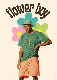 a man standing in front of flowers with the words flower boy on it