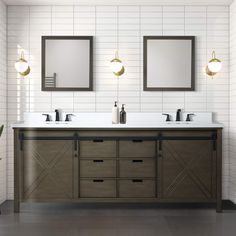 a bathroom with two sinks and mirrors on the wall