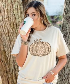 Fall is almost here! That means pumpkins, pumpkin spice, and cool crisp air! Fall is the best time of the year. This leopard pumpkin tee has a variety of options. We offer different tee styles and even different colors! The options are endless. This tee is great for running errands or even sitting in the comfort of your own home sipping on that pumpkin spice latte. Casual Leopard Print T-shirt For Fall, Fall Relaxed Fit Short Sleeve Tops, Relaxed Fit Short Sleeve Tops For Fall, Leopard Print Relaxed Fit Top For Fall, Leopard Print Tops With Relaxed Fit For Fall, White Short Sleeve Shirt For Fall, White Short Sleeve Top For Fall, Leopard Print Top With Relaxed Fit For Fall, Fall Leopard Print Cotton Tops