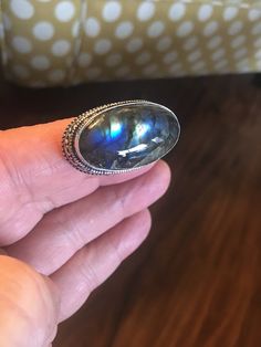 This is a very unique ring I purchased in a vintage jewelry auction. Set in the antique silver plated setting is one beautiful chunk of oval BLUE LABRADORITE gemstone. The stone is a beautiful oval stone as you can see in the photo's. The ring is stamped 925 (very difficult to see, but it's there). The ring shows very little wear... mint condition! The ring is sterling silver with a copper base.   Ring Size: 7.5 Blue Labradorite Rings For Gift, Blue Labradorite Rings As Gift, Blue Labradorite Rings For Gifts, Gift Blue Labradorite Rings, Blue Labradorite Ring, Unique Blue Labradorite Ring, Blue Labradorite Moonstone Ring, Ladies Ring, Jewelry Auction