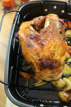 a roasting pan filled with chicken and vegetables