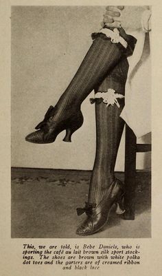 an old photo of a woman's legs in stockings