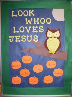 a bulletin board with an owl and pumpkins on it that says, look who loves jesus