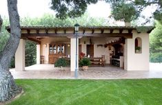 an outdoor kitchen and dining area is shown