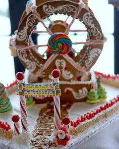 the gingerbread house is decorated with candy canes